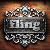 fling word of iron on wooden background photo