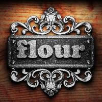 flour word of iron on wooden background photo