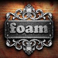 foam word of iron on wooden background photo