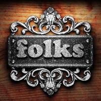 folks word of iron on wooden background photo