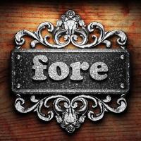 fore word of iron on wooden background photo