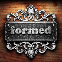 formed word of iron on wooden background photo