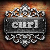 curl word of iron on wooden background photo