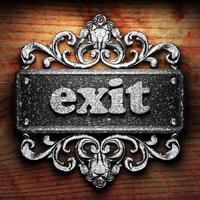 exit word of iron on wooden background photo