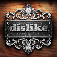 dislike word of iron on wooden background photo