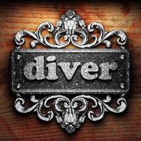 diver word of iron on wooden background photo