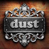 dust word of iron on wooden background photo