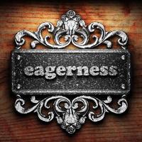 eagerness word of iron on wooden background photo