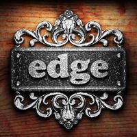 edge word of iron on wooden background photo