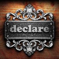 declare word of iron on wooden background photo