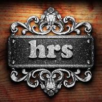 hrs word of iron on wooden background photo