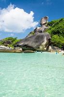 Beautiful landscape people on rock is a symbol of Similan Islands, blue sky and cloud over the sea during summer at Mu Ko Similan National Park, Phang Nga province, Thailand photo