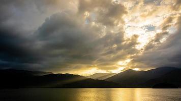 landscape Mountain with colorful vivid sunset on the cloudy sky photo