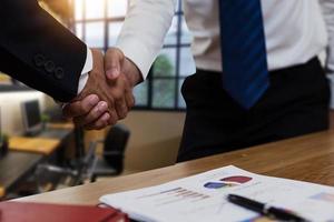successful negotiate and handshake concept, two businessman shake hand with partner to celebration partnership and teamwork, business deal photo