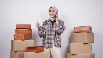 Asian businesswoman on phone gesturing okay isolated on white background photo