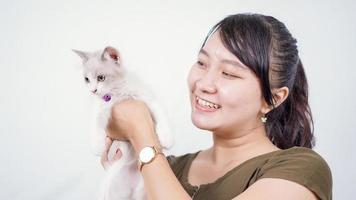 asian woman holding cat laughing isolated white background photo