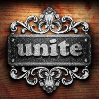 unite word of iron on wooden background photo