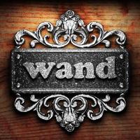 wand word of iron on wooden background photo