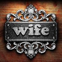 wife word of iron on wooden background