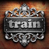 train word of iron on wooden background photo