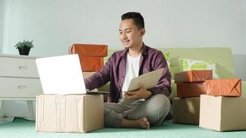 asian business man working using laptop at home photo