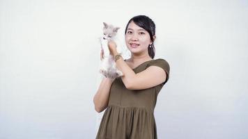 asian woman holding cat laughing isolated white background photo