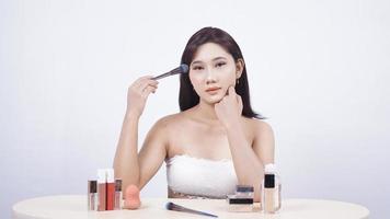 Asian beauty wearing make up isolated on white background photo