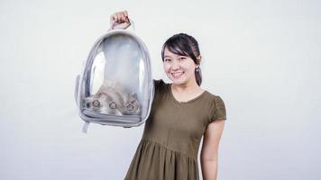 asian woman holding cat laughing isolated white background photo