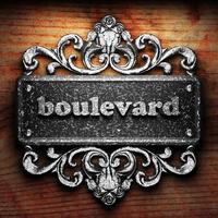 boulevard word of iron on wooden background photo