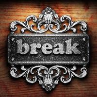 break word of iron on wooden background photo