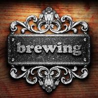 brewing word of iron on wooden background photo