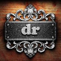 dr word of iron on wooden background photo