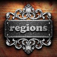 regions word of iron on wooden background photo