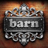 barn word of iron on wooden background photo