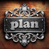 plan word of iron on wooden background photo