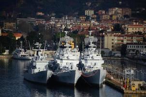 three antique warships in harbor photo