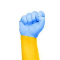 raised fist painted with flag of Ukraine photo