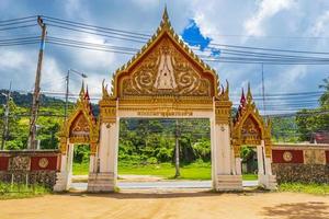 Colorful architecture of entrance gate Wat Ratchathammaram temple Thailand.