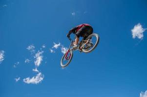 Liivigno Italy 2014 Boy who finishes the descent by bike with a jump photo