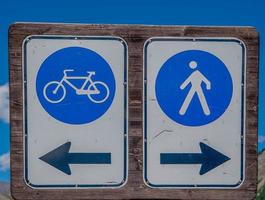 Passing signs for pedestrians and cyclists photo