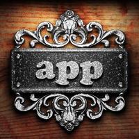 app word of iron on wooden background photo