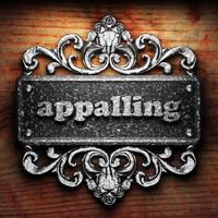 appalling word of iron on wooden background photo