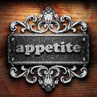 appetite word of iron on wooden background photo