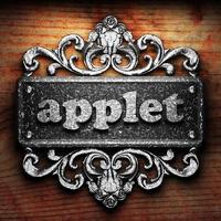 applet word of iron on wooden background photo