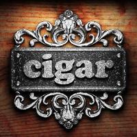 cigar word of iron on wooden background photo