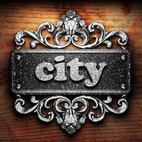 city word of iron on wooden background photo