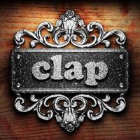 clap word of iron on wooden background photo