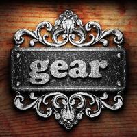 gear word of iron on wooden background photo