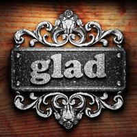 glad word of iron on wooden background photo