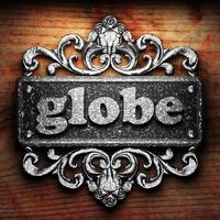 globe word of iron on wooden background photo